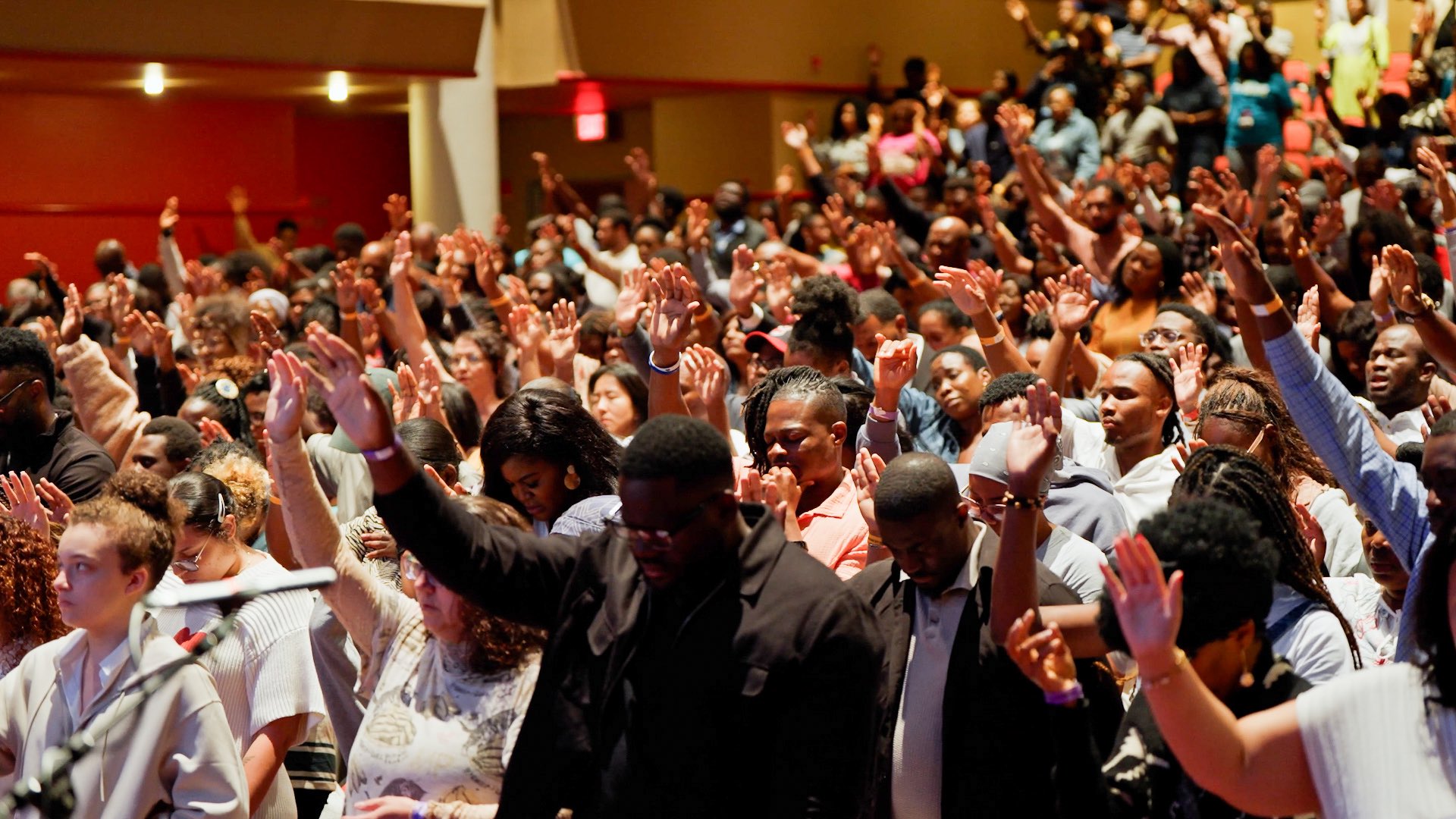 Pastor ministering at Night of Glory — Camp Meeting healing service